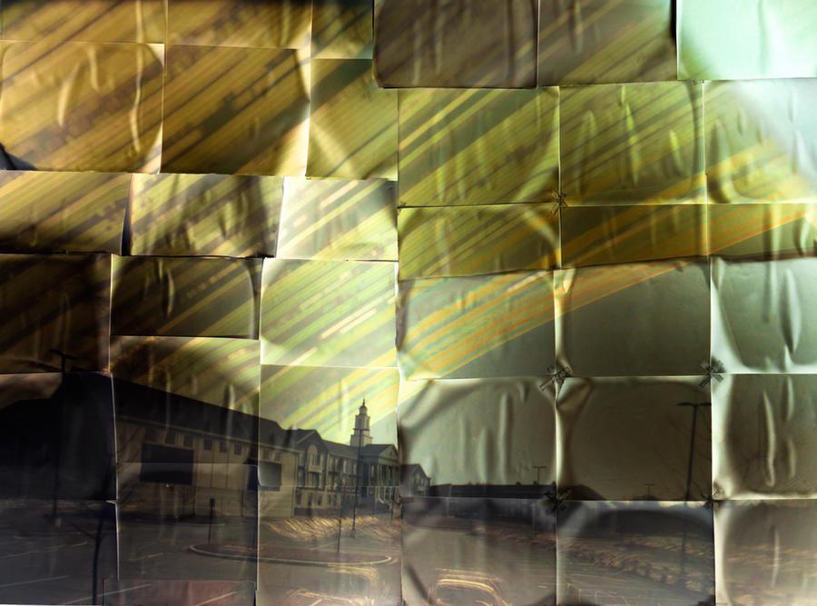 A solargraph shows the path of the sun over a building with a tower, composed of many individual images.