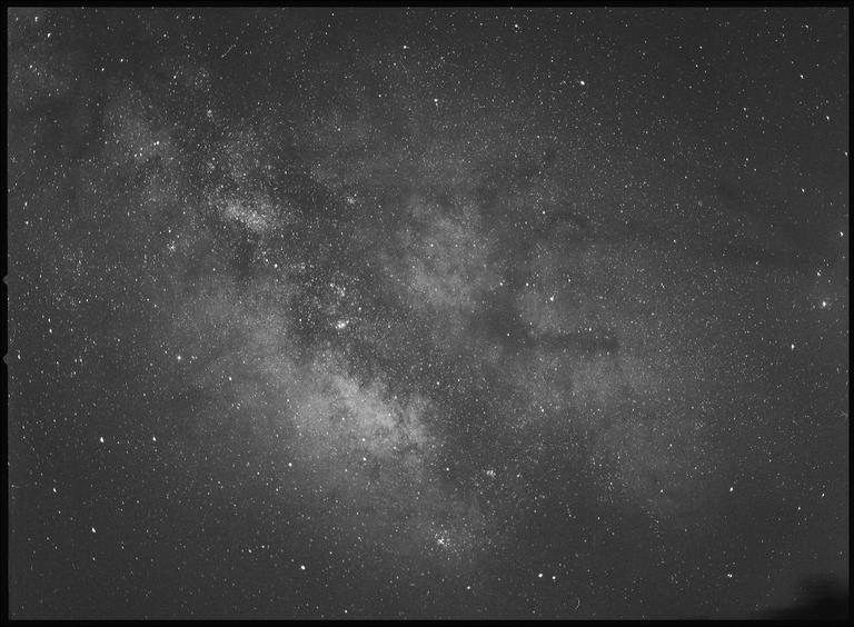The milky way is visible in the night sky.