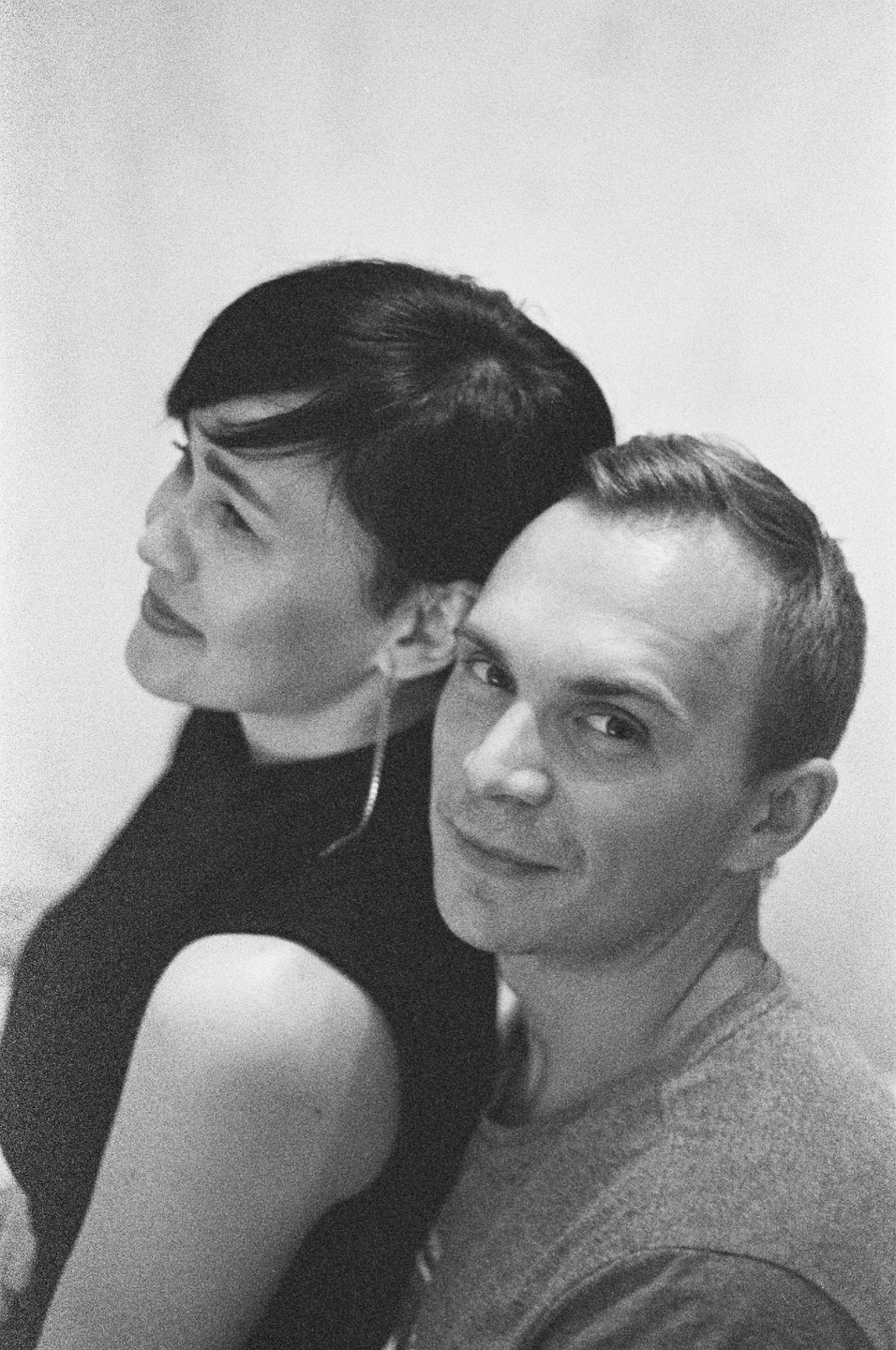 A man and a woman are posing for a portrait.