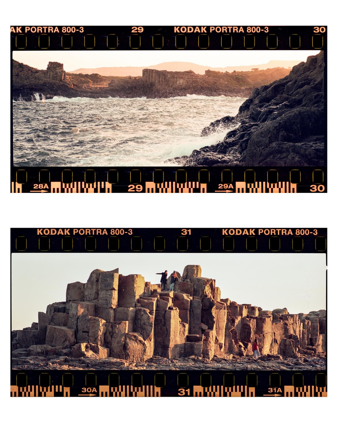 Waves crash against a rocky coastline with columnar basalt formations in the background.