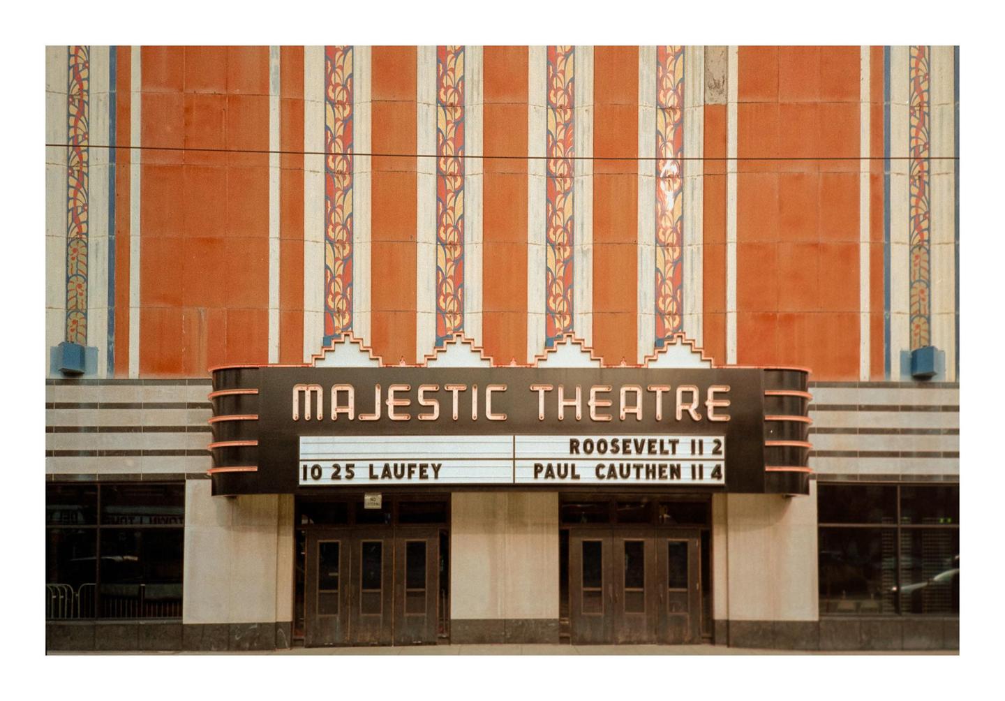 The Majestic Theatre marquee displays showtimes above its entrance.
