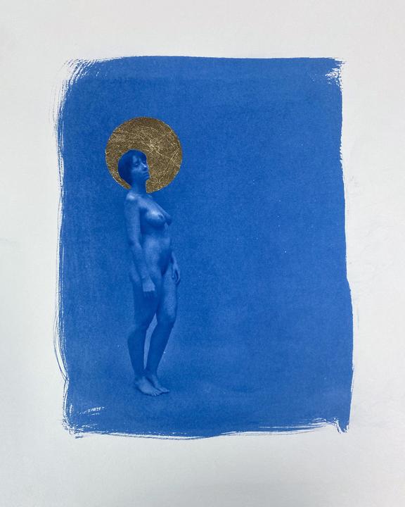 A nude woman with a gold halo stands against a blue background.