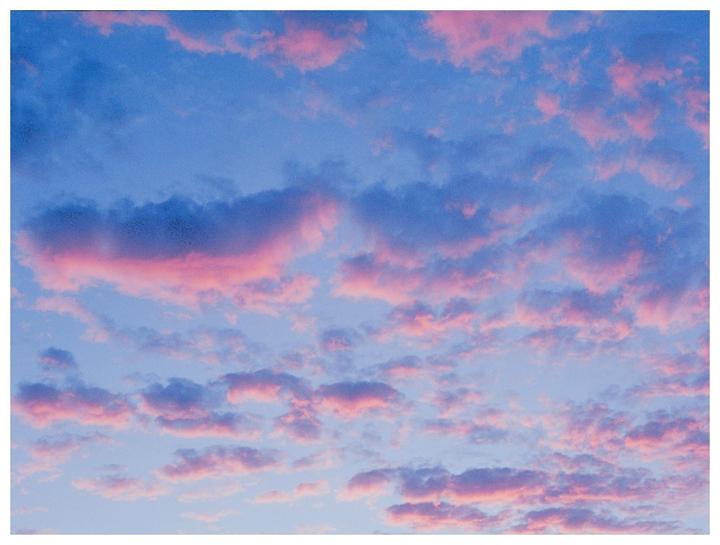 Pink and blue clouds fill the sky.