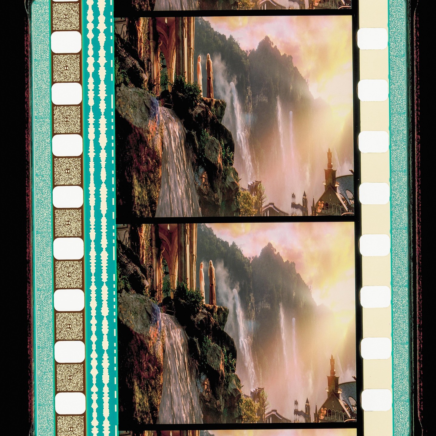 A film strip shows a fantasy landscape with waterfalls, mountains, and buildings.