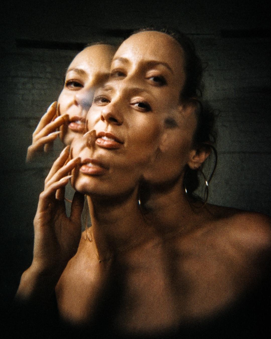 A woman's face is shown multiple times in a single frame, creating a layered effect.