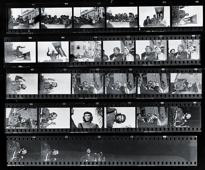 A contact sheet displays multiple black and white frames, some showing crowds, men speaking at a podium, and close-ups of a man in a beret.
