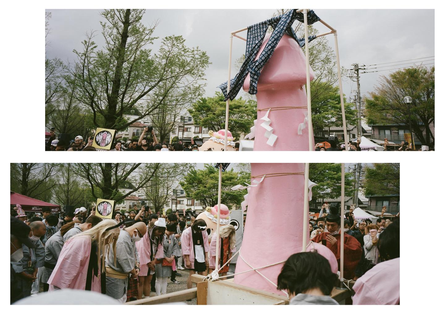 A large pink phallus is carried through a crowd of people during the Kanamara Festival.