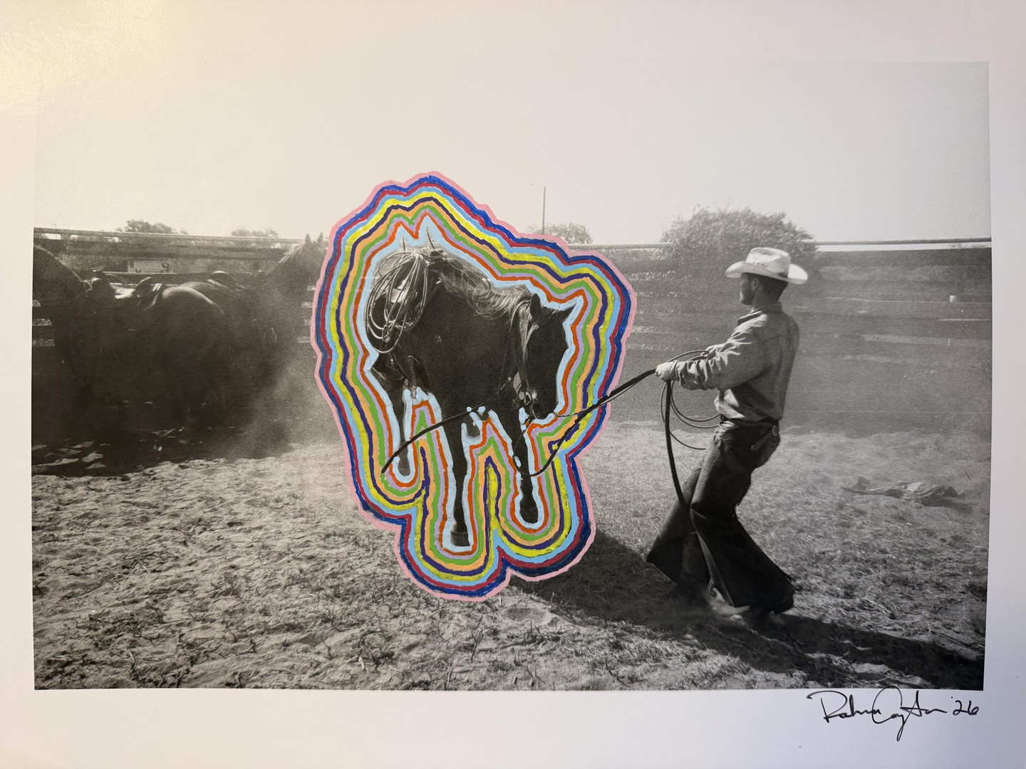 A man in a cowboy hat pulls a horse with a rope, with colorful lines painted around the horse.