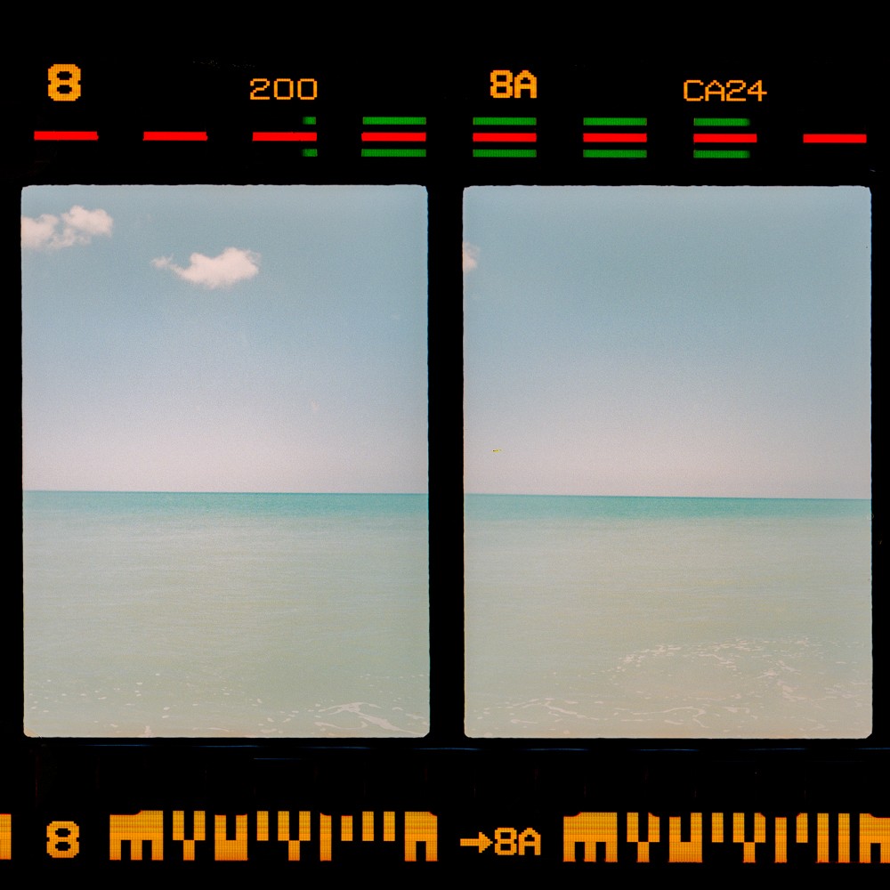 Two frames show a calm ocean under a clear sky with a single cloud.