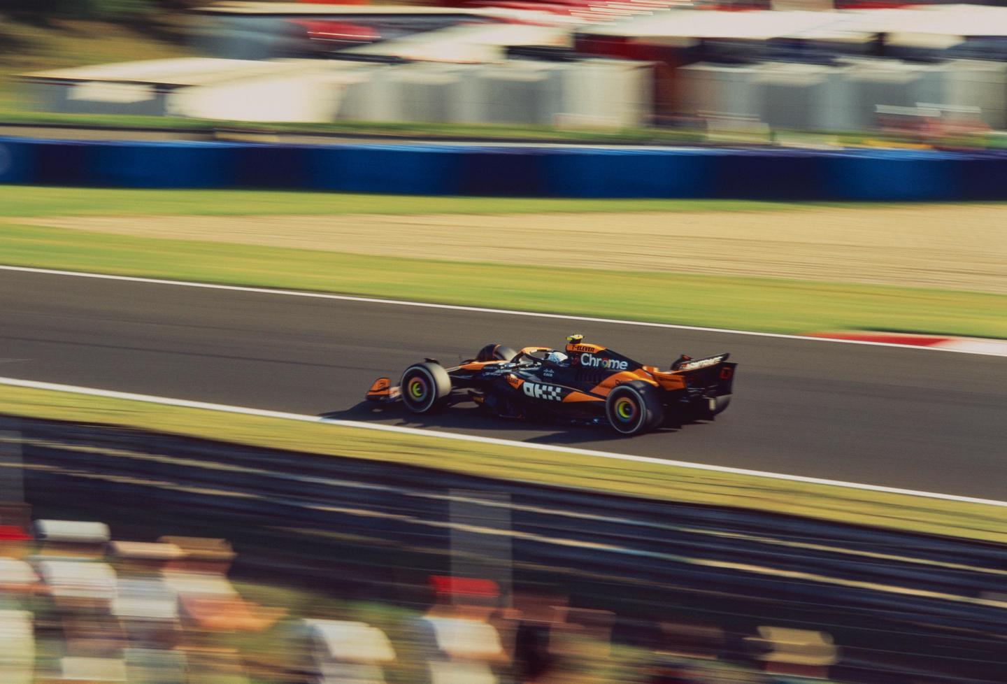 A McLaren Formula 1 car speeds around a track during the Hungarian Grand Prix.