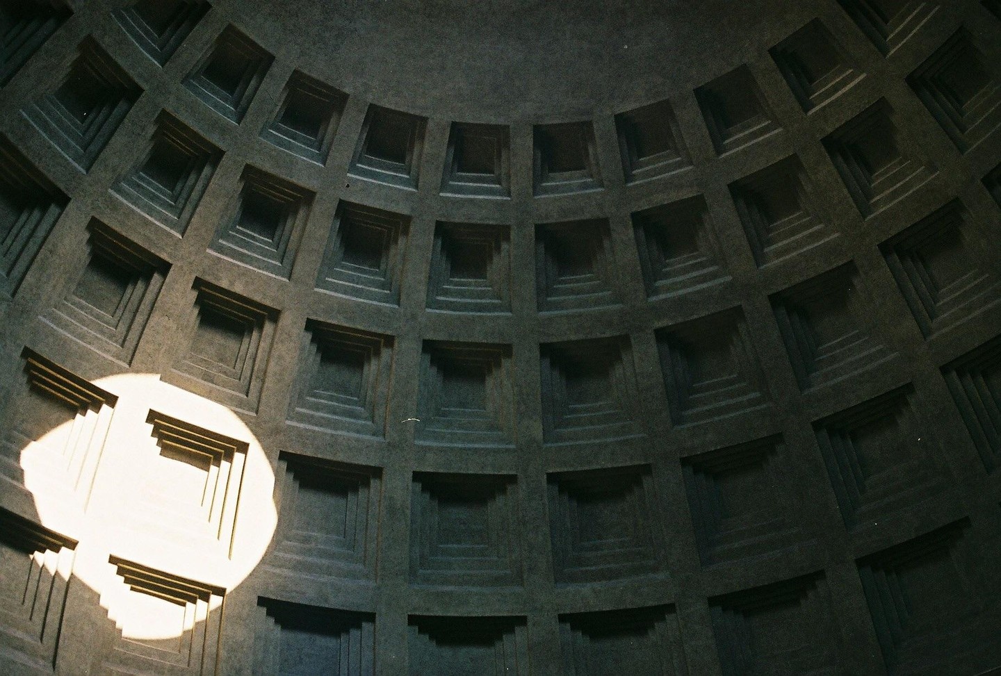 The coffered dome of the Pantheon is illuminated by a circular oculus.