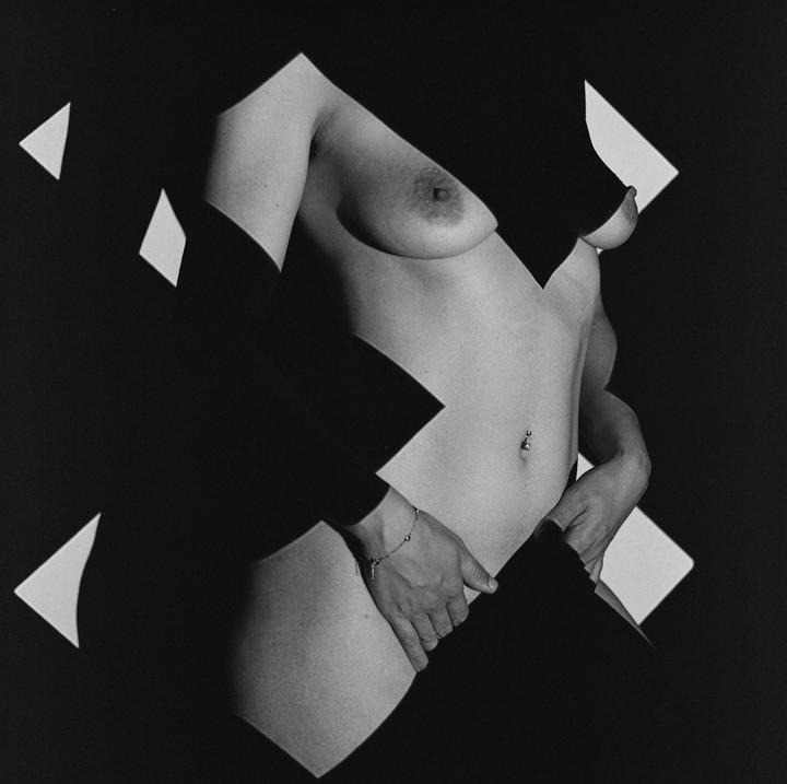A woman's torso is visible through geometric cutouts in a black background.