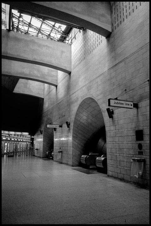 A wide-angle view shows the interior of Southwark Station with signs for the Jubilee line.
