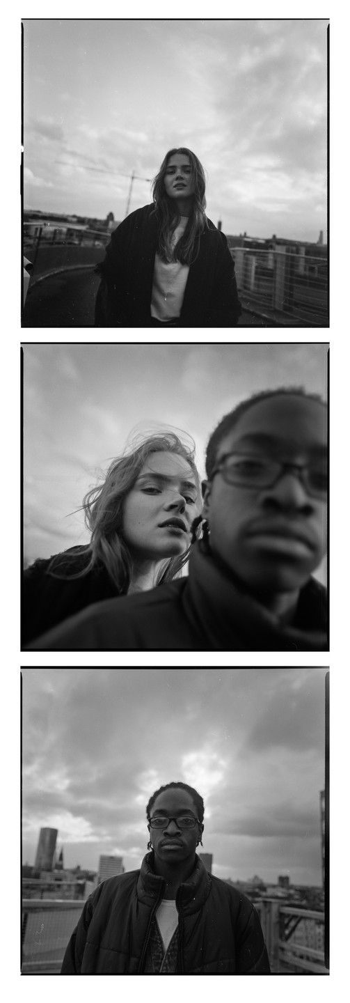 Three black and white portraits show a woman and a man on a rooftop with a city skyline in the background.