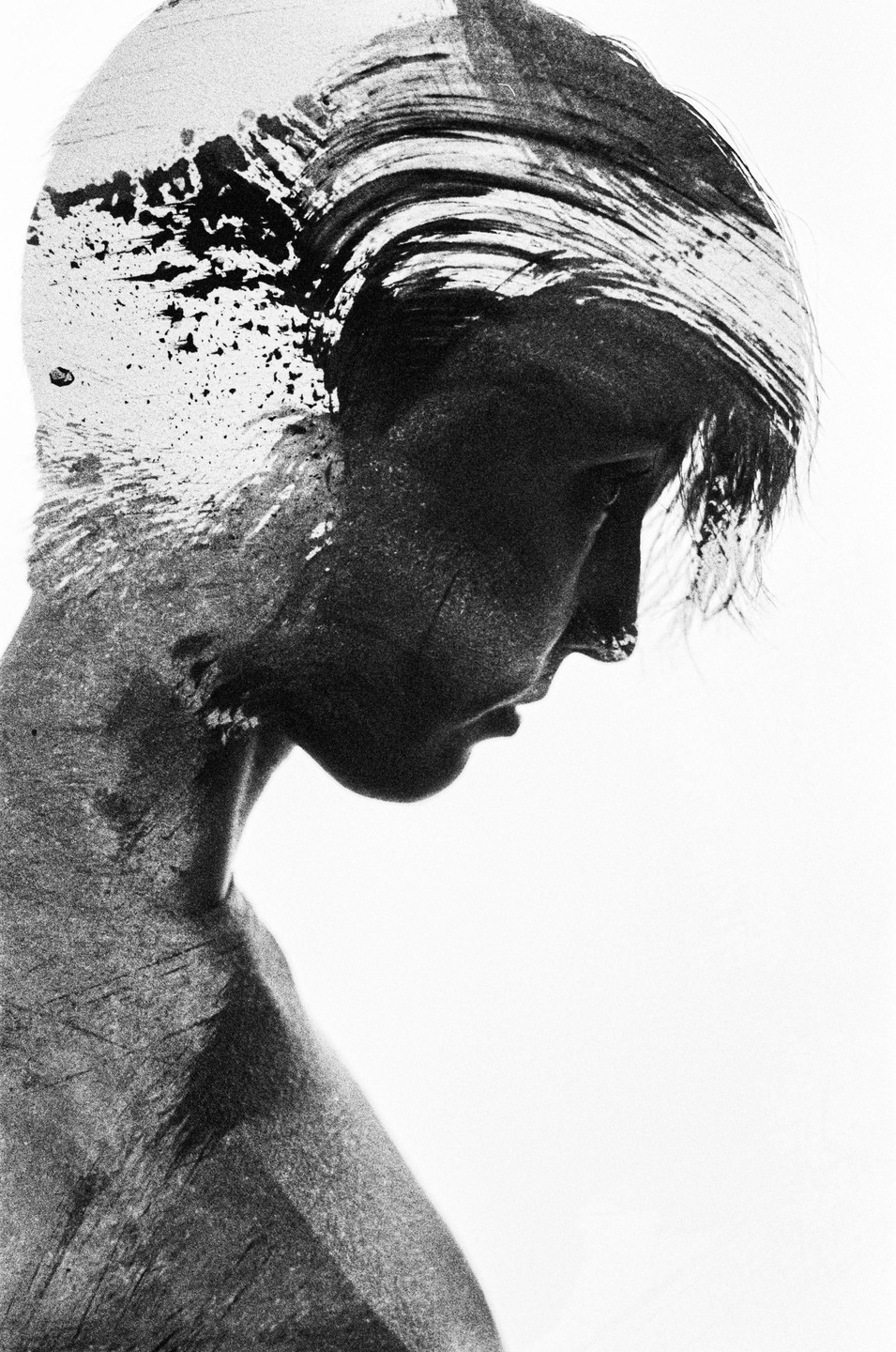 A double exposure shows a woman's profile overlaid with abstract brushstrokes and textures.
