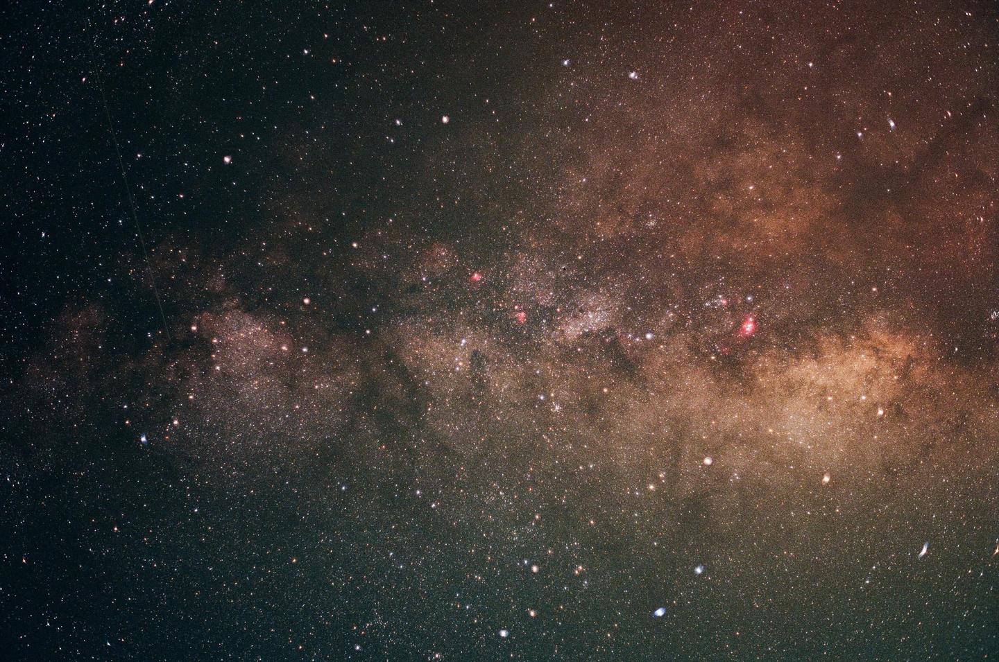 The Milky Way galaxy is visible in the night sky.