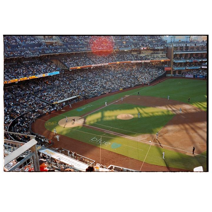 A baseball game is in progress at a stadium filled with spectators.