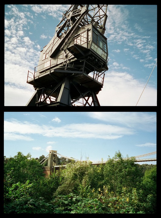 A diptych shows a large industrial crane against a cloudy sky in the top frame, and a suspension bridge partially obscured by lush green trees in the bottom frame.