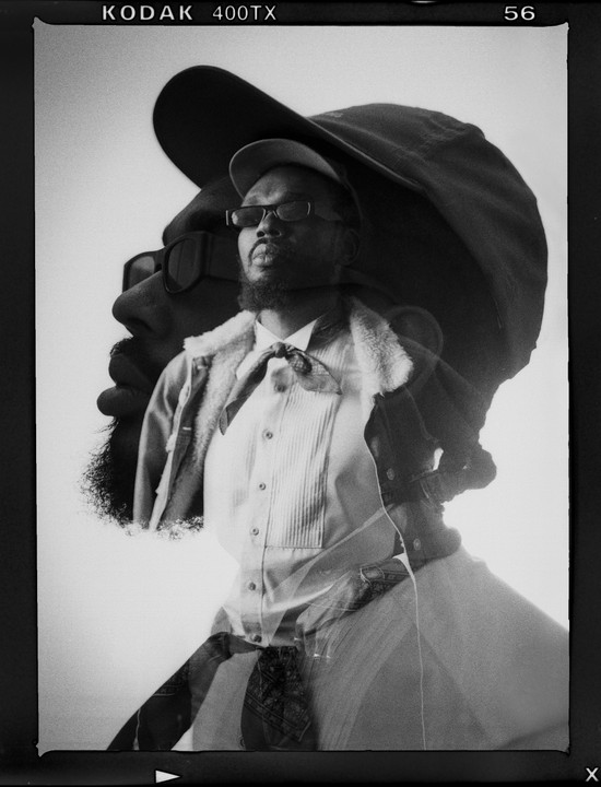 A man wearing a cap and sunglasses is captured in a double exposure portrait.