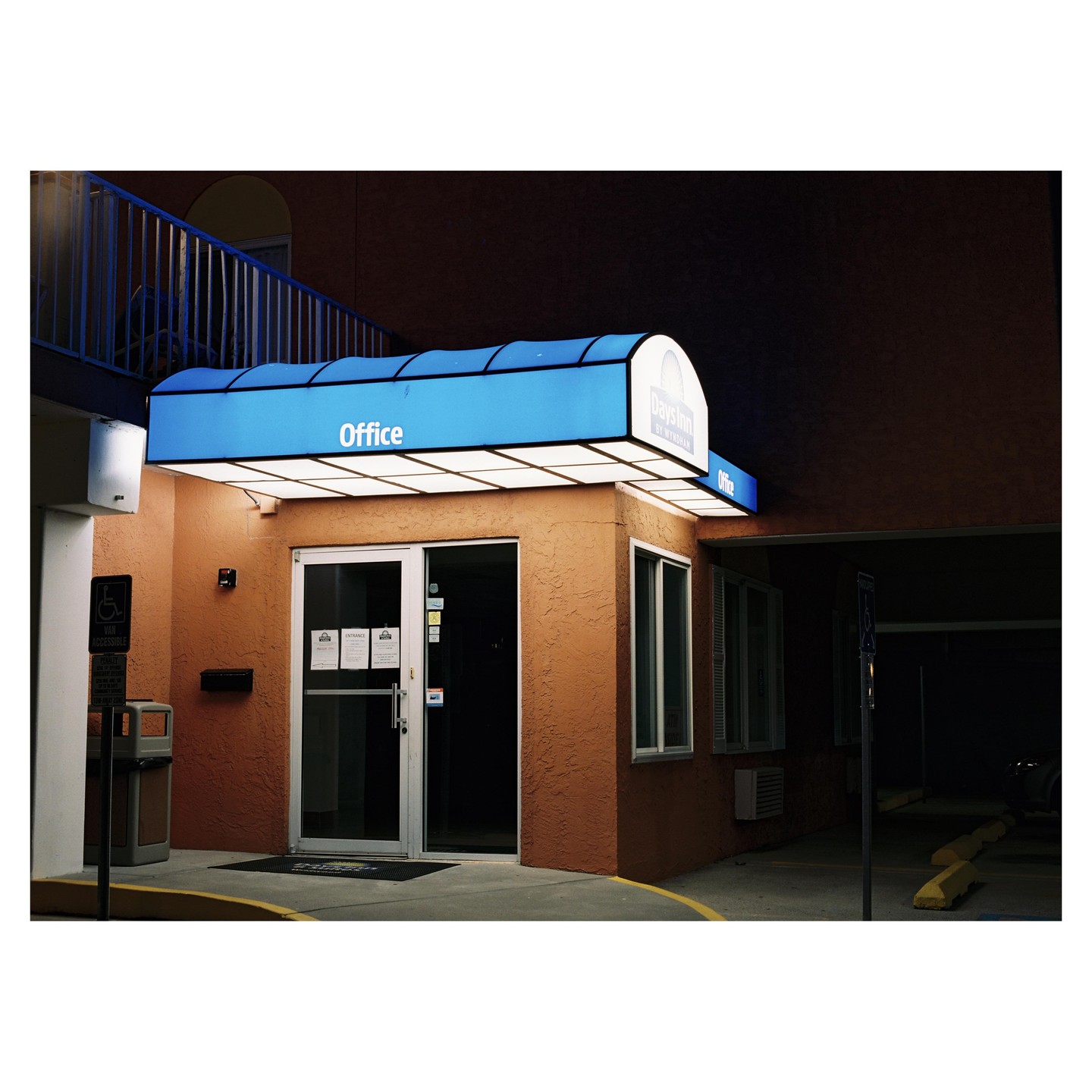 The office of a Days Inn by Wyndham is illuminated at night.