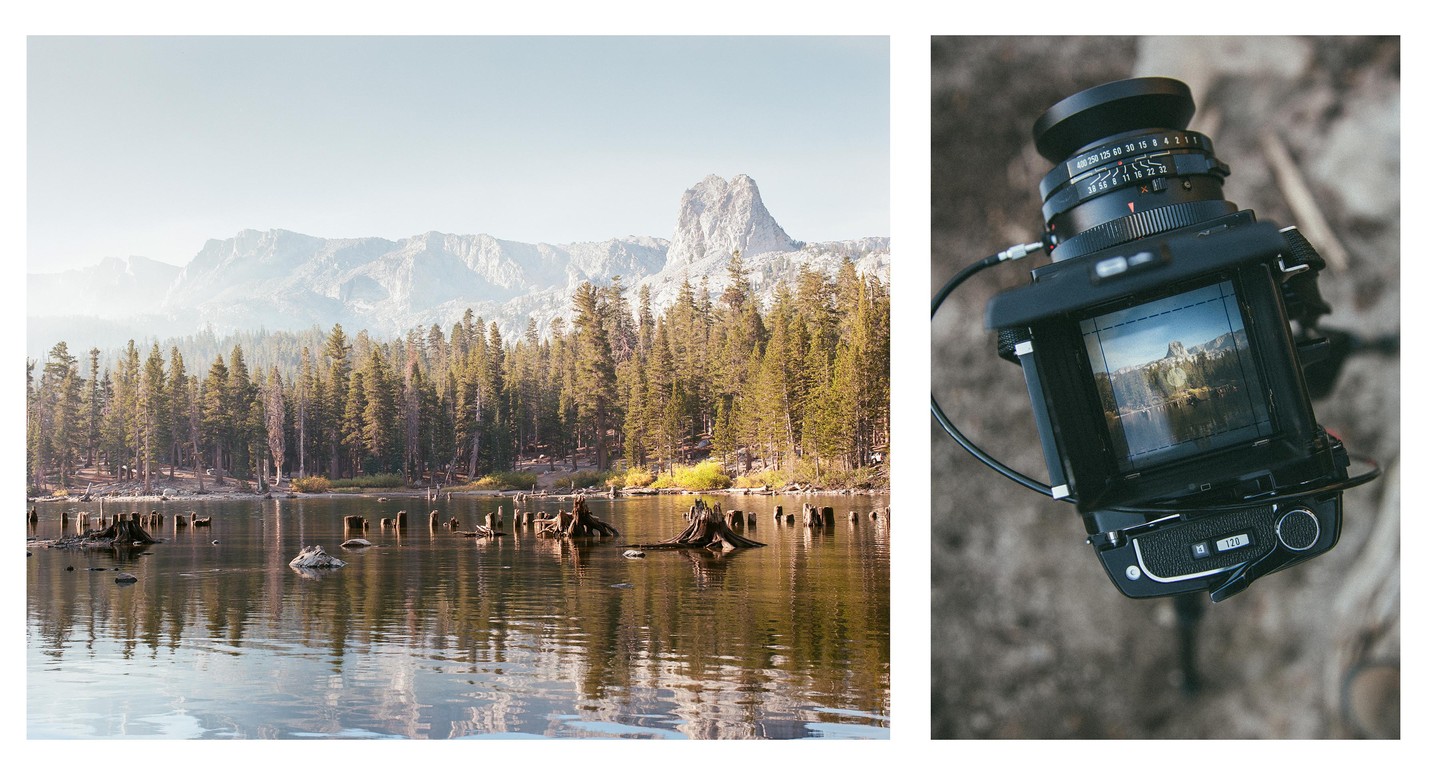 A hazy mountain landscape with a lake and pine trees is shown next to a camera viewfinder displaying the same scene.