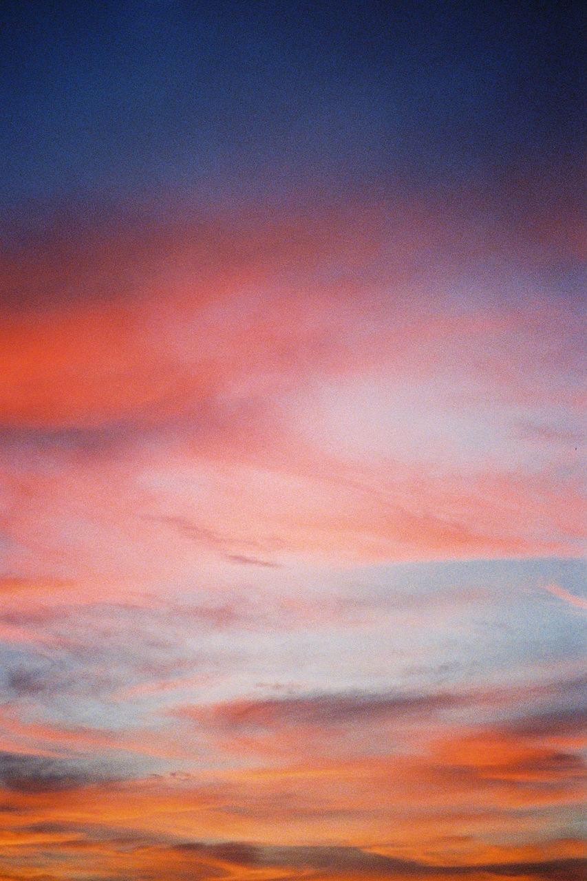 The sky is filled with colorful clouds during sunset.