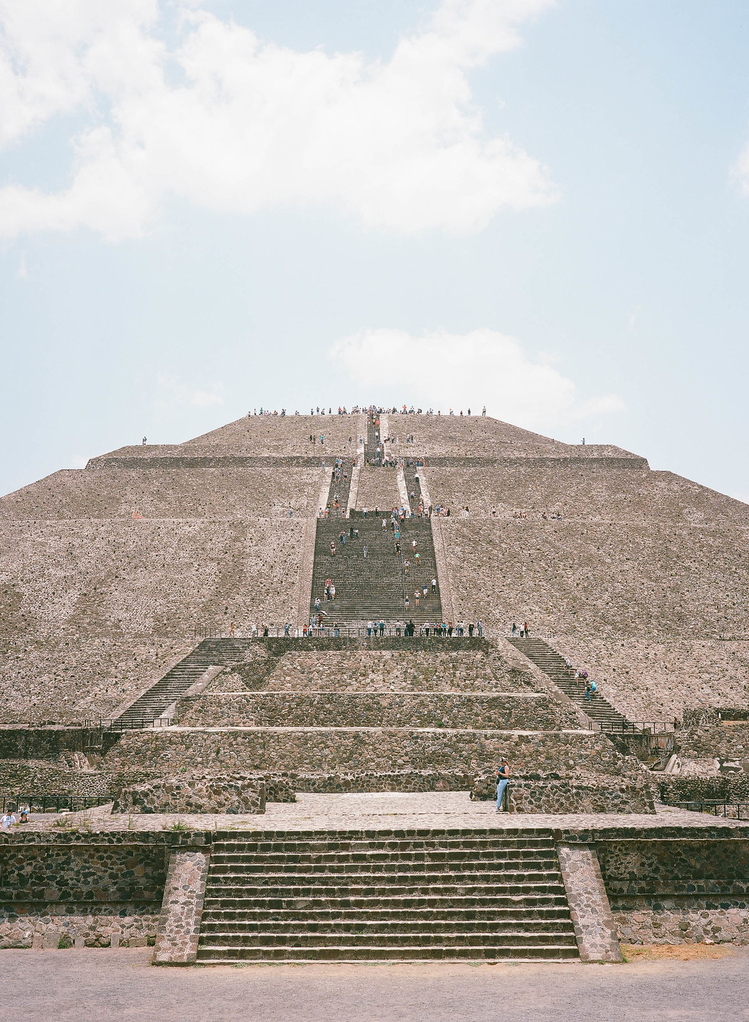 Many people climb the stone steps of the Pyramid of the Sun in Teotihuacan, Mexico City.