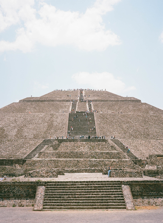 Many people climb the stone steps of the Pyramid of the Sun in Teotihuacan, Mexico City.